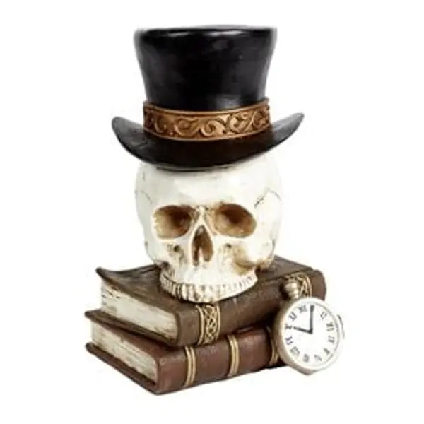 Statue crâne et livre noir
